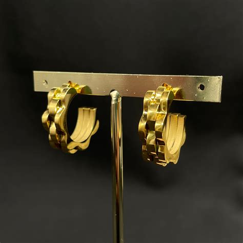 arracadas rolex